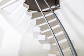 White Zeus Silestone spiral staircase hanged.